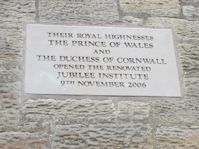 Jubilee Hall dedication flag stone reading 'Their Royal Highness The Prince of Wales and The Duchess of Cornwall opened the renovated Jubilee Institute 9th November 2006'